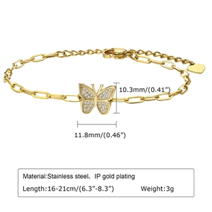 Detail of 18K gold butterfly pendant with white zircon inlays and lobster clasp