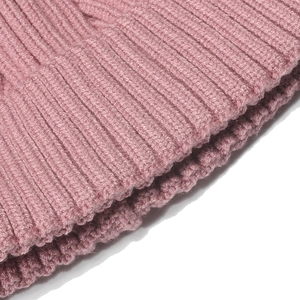 Macro detail of pink rib knit fabric showing soft texture for children winter set