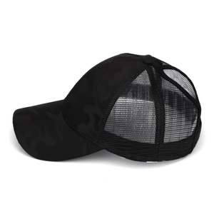 Side view of black camo ponytail baseball cap with breathable mesh and curved brim