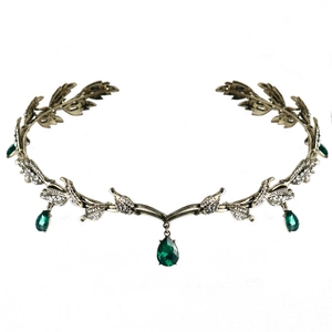 Detailed close-up of bronze leaf bridal crown with green teardrop crystal pendants