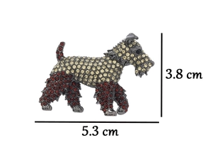 Detail showing dimensions of a dog brooch with yellow and red rhinestones