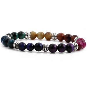 Macro detail of 8mm colorful tiger eye stone beads with vintage silver spacer charms