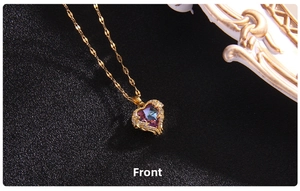 Macro shot of heart-shaped gradient crystal pendant with pave-set zircon on gold chain