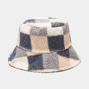 Detailed close-up of a checkered fleece bucket hat showing thick plush fabric texture