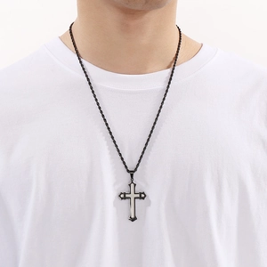 Detail of a black double-layered cross pendant on a twist rope chain for men