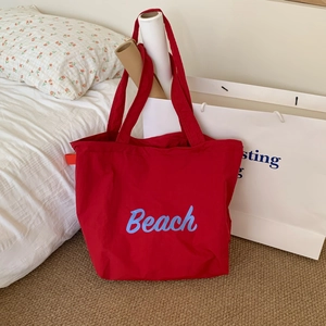 Large red canvas tote bag with light blue Beach print for summer leisure shopping