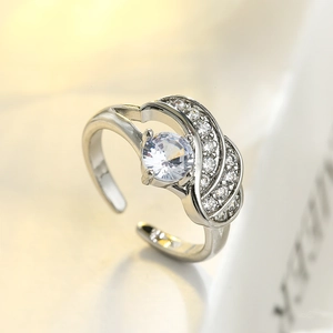 Silver adjustable ring with large round crystal and wing-inspired zircon micro-paving