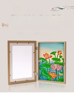 Close-up of wooden storage picture frame with 180-degree hinge for children artwork