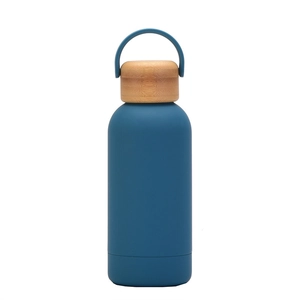 Detail of a 350ml navy blue vacuum insulated bottle with natural bamboo lid and handle
