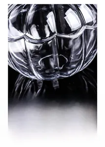Detailed macro view of the crystal glass texture and vertical ribs on the pumpkin fruit bowl