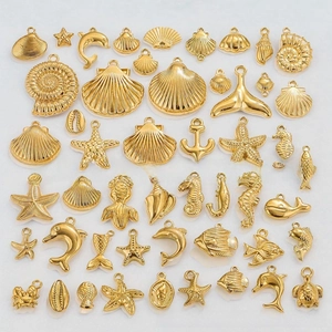Detailed collection of golden ocean charms including starfish, shells, and seahorses for DIY