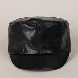 Detail of black faux leather flat top military cap showing fine textured grain finish