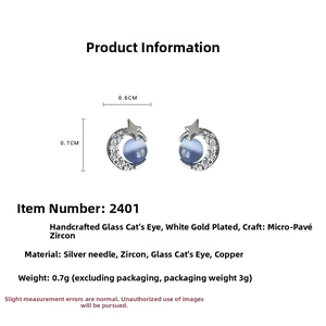 Detailed view of mini crescent moon and star stud earrings with blue cat eye stones