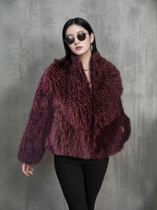 Faux fox fur coat in dark purple featuring a large lapel and plush fluffy texture