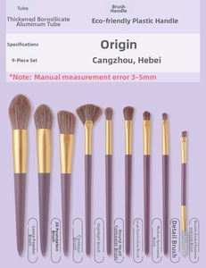 Detailed macro shot of 9-piece purple makeup brush set with gold aluminum tubes