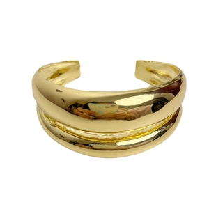 Polished double-layered golden open cuff bracelet with a modern irregular metal design