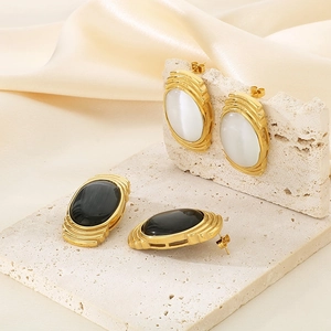 French vintage gold stainless steel earrings with oval opal stones on white stone