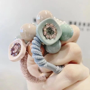 Minimalist elastic hair tie with macaron beads and sparkling rhinestone flower accents