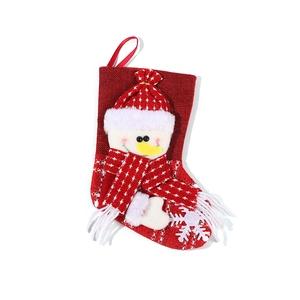 Red Christmas stocking with 3D snowman character and white tassels for holiday tree decor