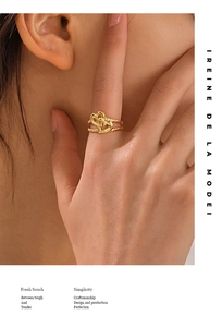 Close-up of 18K gold plated double heart adjustable ring worn on female hand