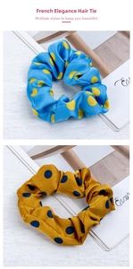 Detailed shot of satin polka dot scrunchies in bright blue and ginger yellow colors