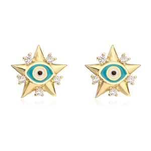 Macro shot of 18K gold plated evil eye star earrings with zircons and enamel detail
