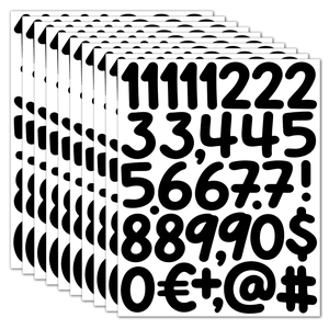 Macro view of stacked 2-inch black vinyl waterproof numeric and currency symbol stickers