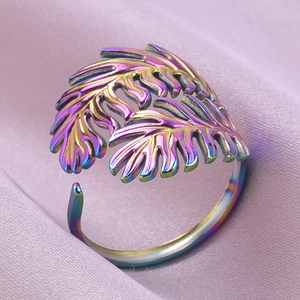 Macro detail of rainbow gradient leaf ring with adjustable open band and leaf texture