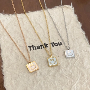 Three-piece set of smiley face necklaces in gold, rose gold, and silver finishes for women