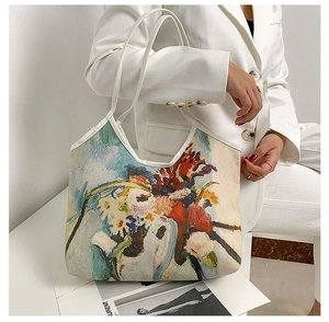 Artistic oil painting floral print canvas tote bag styled with a white blazer