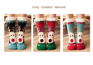 Detail of warm Christmas floor socks with plush lining and 3D reindeer patterns