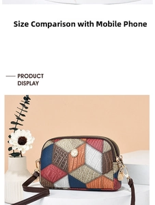 Detail of color-block patchwork purse featuring crocodile embossed texture and dual zippers