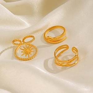 Three-piece gold-plated stainless steel ring set featuring snake and sunburst designs