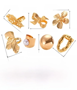 Size chart for gold alloy napkin rings with various leaf, floral, and bow designs
