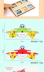 Wooden busy board toy detail showing a colorful airplane puzzle piece with size dimensions