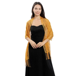 Detail of hollow floral lace shawl in ginger yellow with elegant long fringe trim