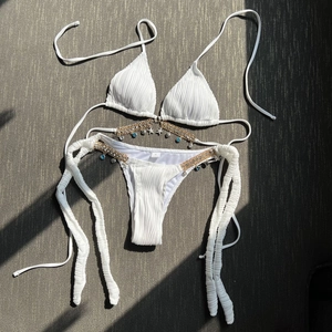 White ribbed bikini set with gold nautical chains featuring blue beads and starfish charms