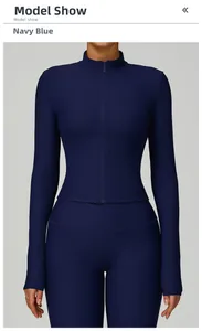 Detail of navy blue ribbed fabric and zipper on slim fit long sleeve yoga jacket