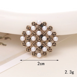 Macro shot of 2cm vintage pearl charm with golden alloy base for DIY accessories