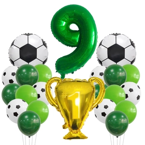 Detail of soccer party set with green number 9 balloon and gold champion trophy