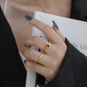 Minimalist gold-plated stainless steel rings with black inlay and heart chain design