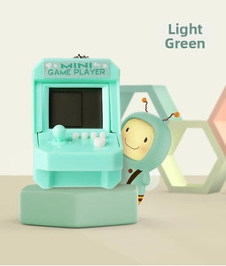 Macro shot of a mint green mini arcade game console keychain with white buttons