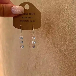 Elegant geometric drop earrings with three sparkling clear crystals on silver ear hooks
