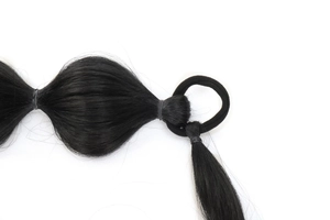 Detail of a 75cm black bubble ponytail extension with tiered elastic bands and hair tie
