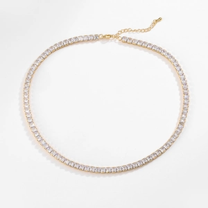 Detail of gold-plated tennis necklace with square zircons, lobster clasp and extender