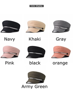 Detail view showing seven color options of navy style hats with silver chain accessories