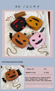 Detailed close-up of pumpkin-shaped Halloween crossbody bags with glitter wings and chain