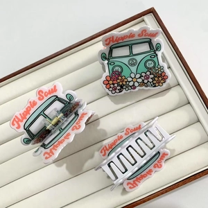 Three acrylic hippie soul hair claws featuring vintage green bus and flower patterns