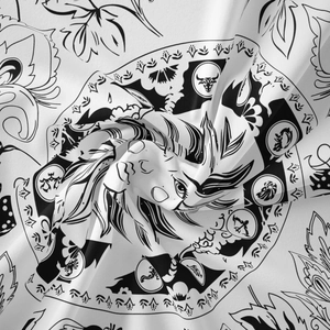 Macro detail of Bohemian tapestry showing soft fabric folds and complex zodiac mandala prints