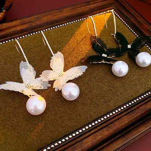 Elegant butterfly mesh pearl earrings with crystals and gold long chain hook